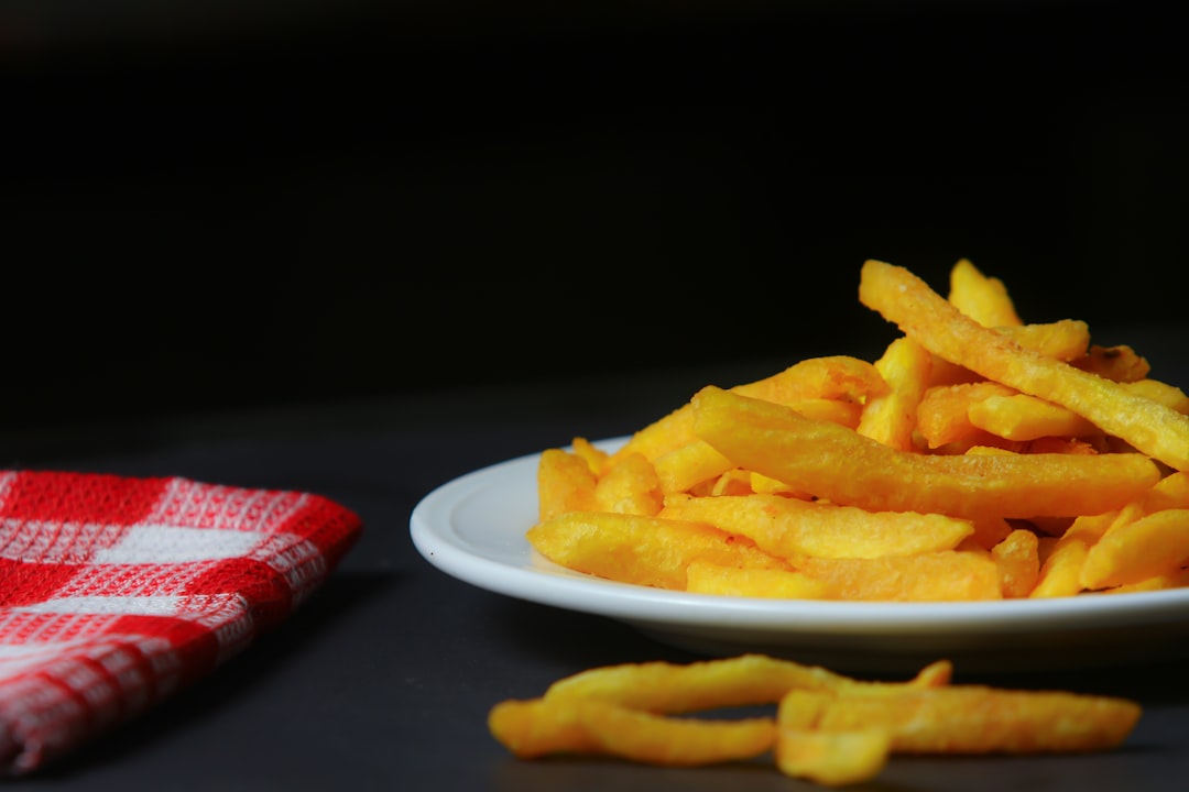 a plate of french fries on a table