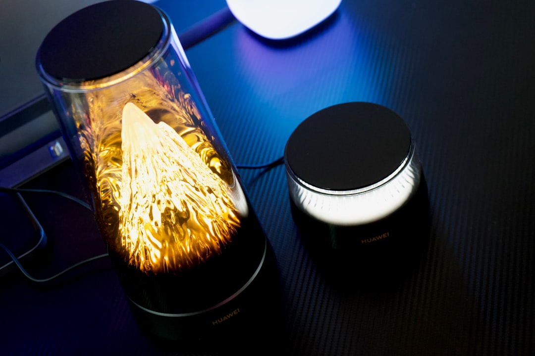 A glowing decorative lamp with a smaller light beside it