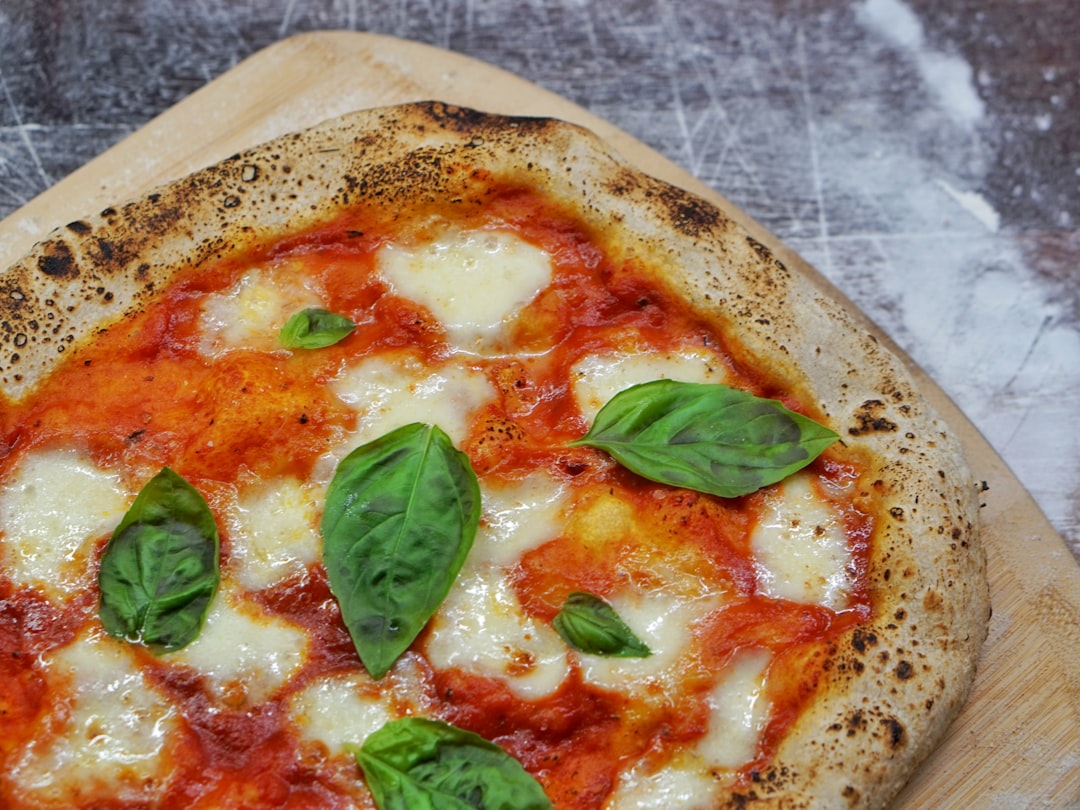 pizza with green leaf on top