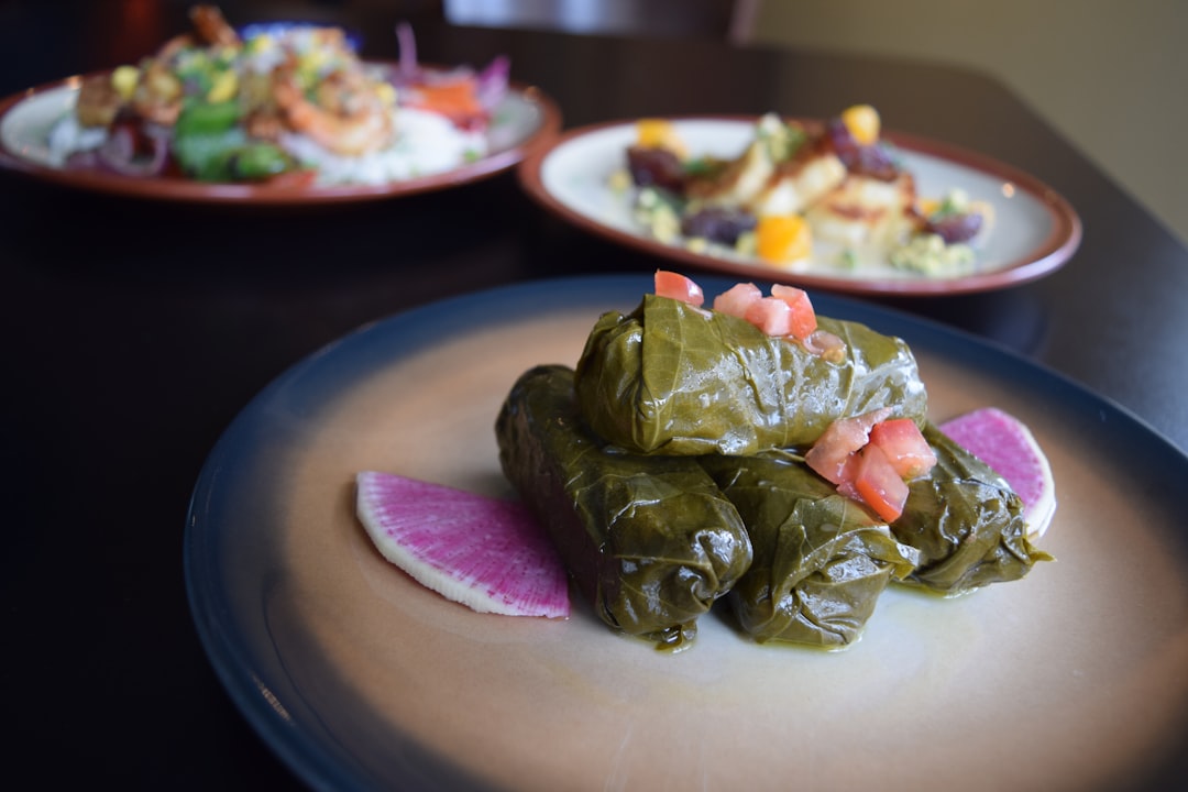 a plate of food on a table with other plates of food